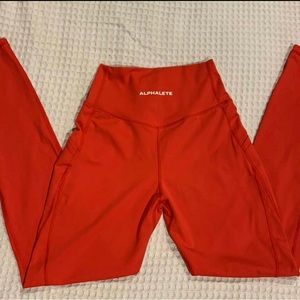 Alphalete surface red with side pockets size small